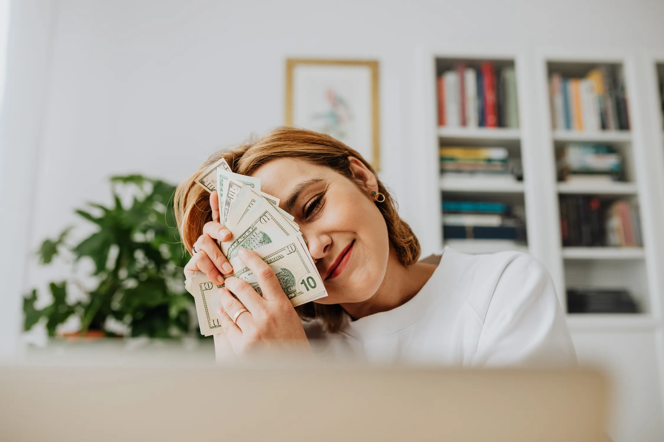 Homeowner smiling while reviewing household finances