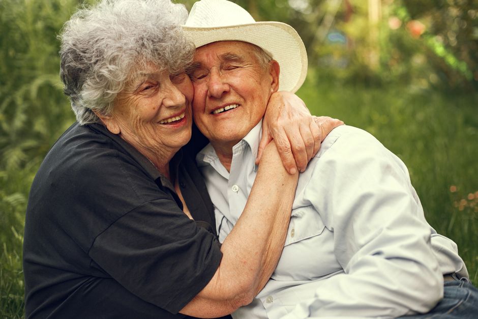 Retired couple relaxing together outdoors